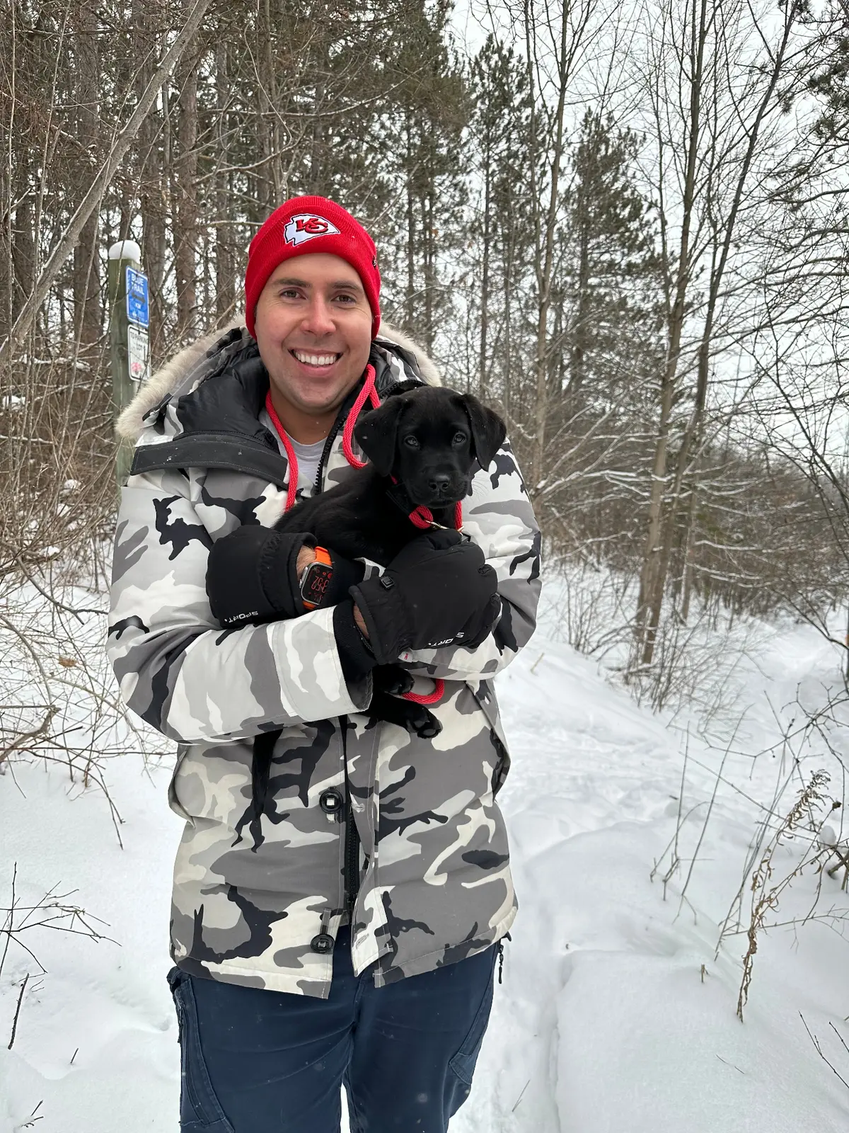 RJ Kayser outdoors with his dog